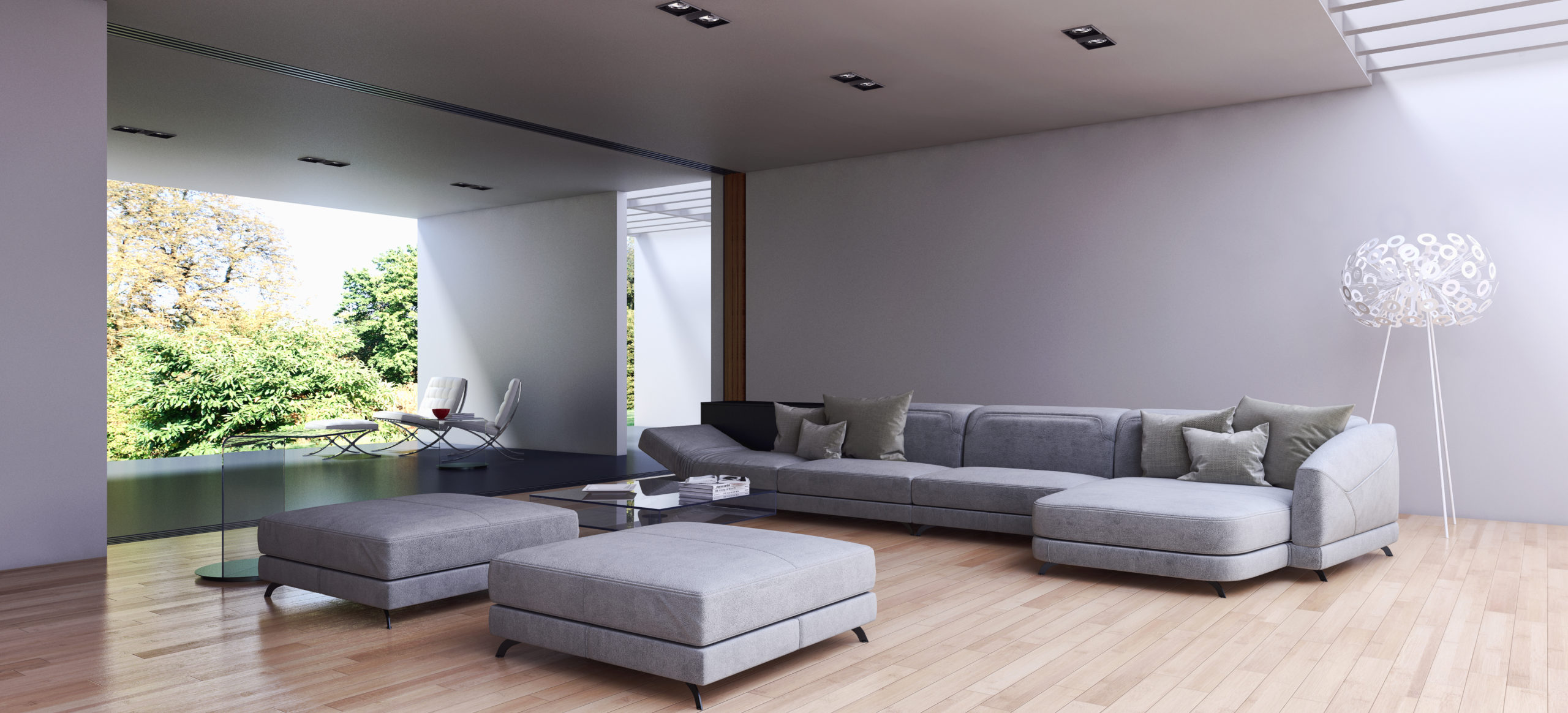 Contemporary living room, gray sofa and ottomans.