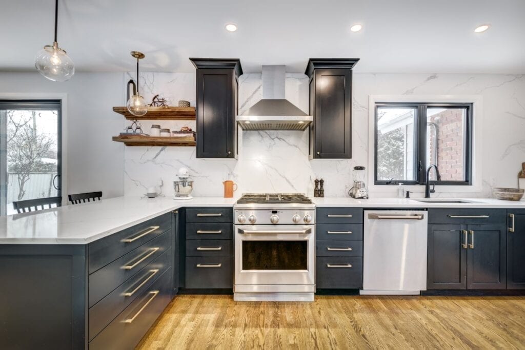 Modern kitchen with navy blue cabinets and no island