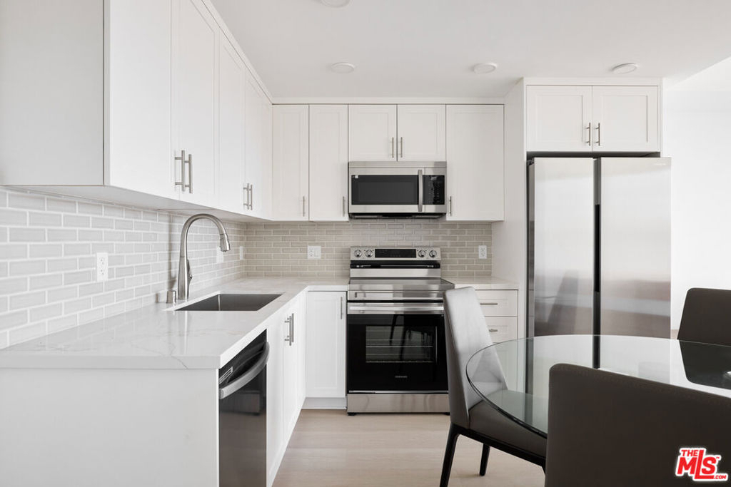 Modern kitchen with stainless steel appliances