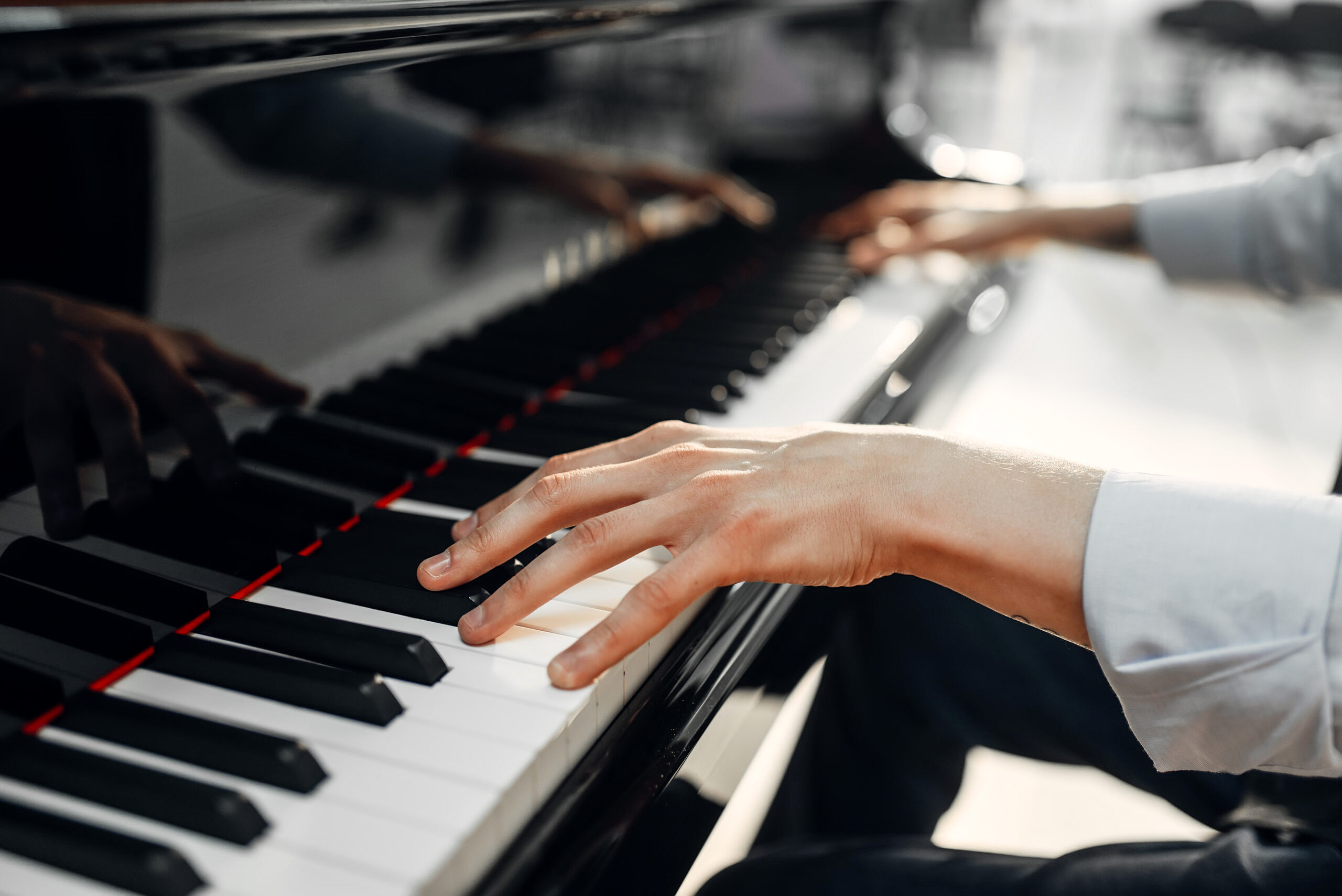 A person plays a classical piano. 