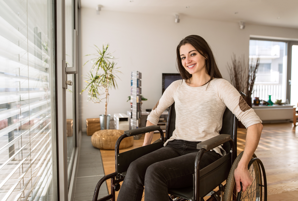 disabled woman in apartment living room 