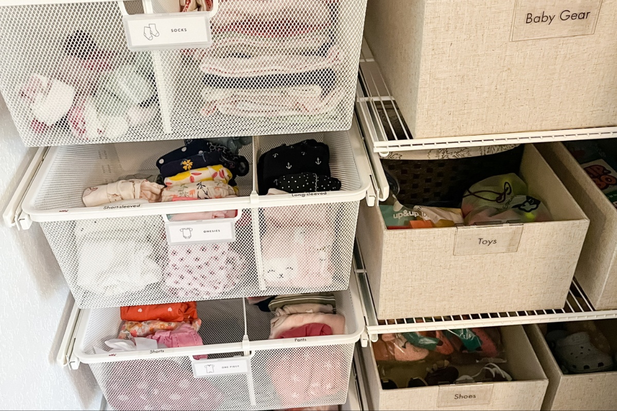 baby clothes in organized bin 