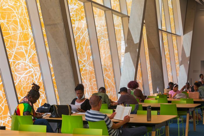 The tinted glass walls give light an amber glow.